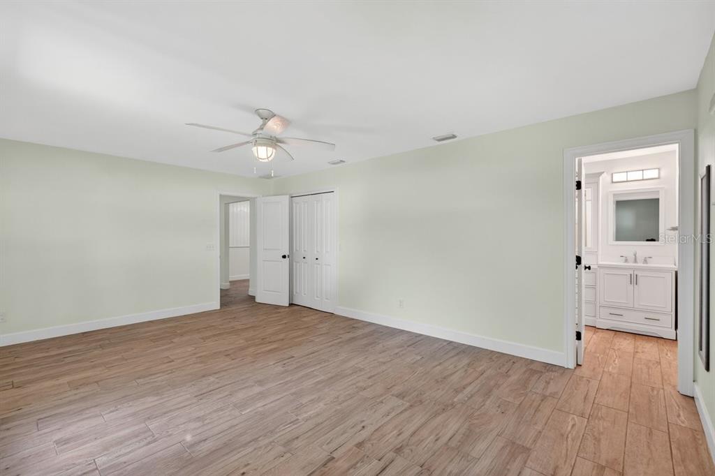171 William Street Edgewater, FL 32141 - Photo 19 of 40 wooden floor in an empty room with a window