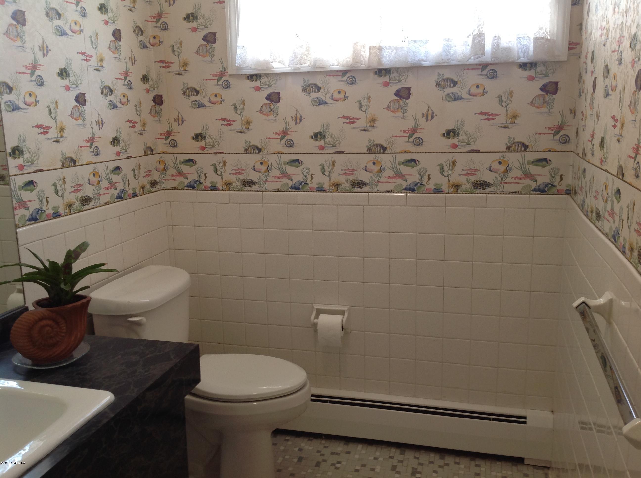 6 Griffith Road Riverside, CT 06878 - Photo 15 of 24 a bathroom with a toilet and a sink