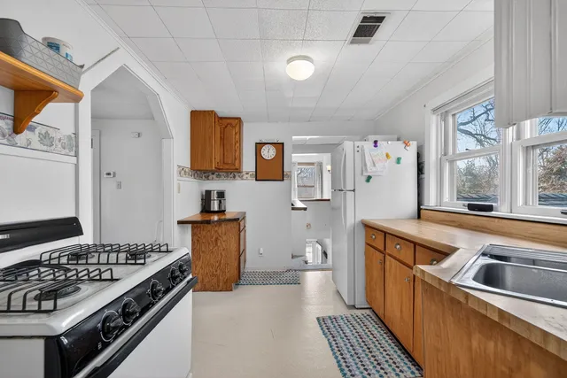 a kitchen that has a sink and a stove