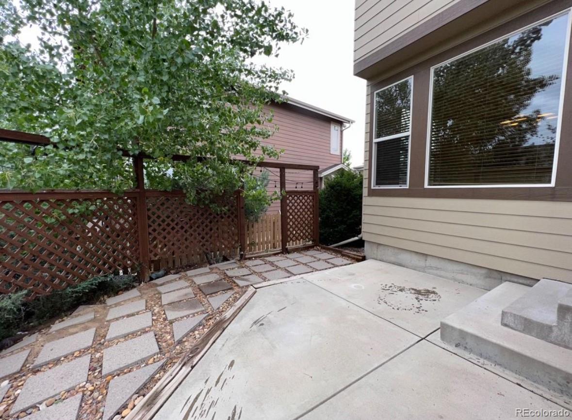 10847 Towerbridge Road Highlands Ranch, CO 80130 - Photo 14 of 14 a backyard of a house with lots of green space