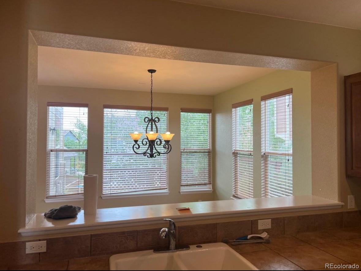 10847 Towerbridge Road Highlands Ranch, CO 80130 - Photo 4 of 14 a room with pool table and windows