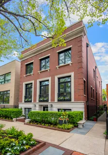 a front view of a building with garden