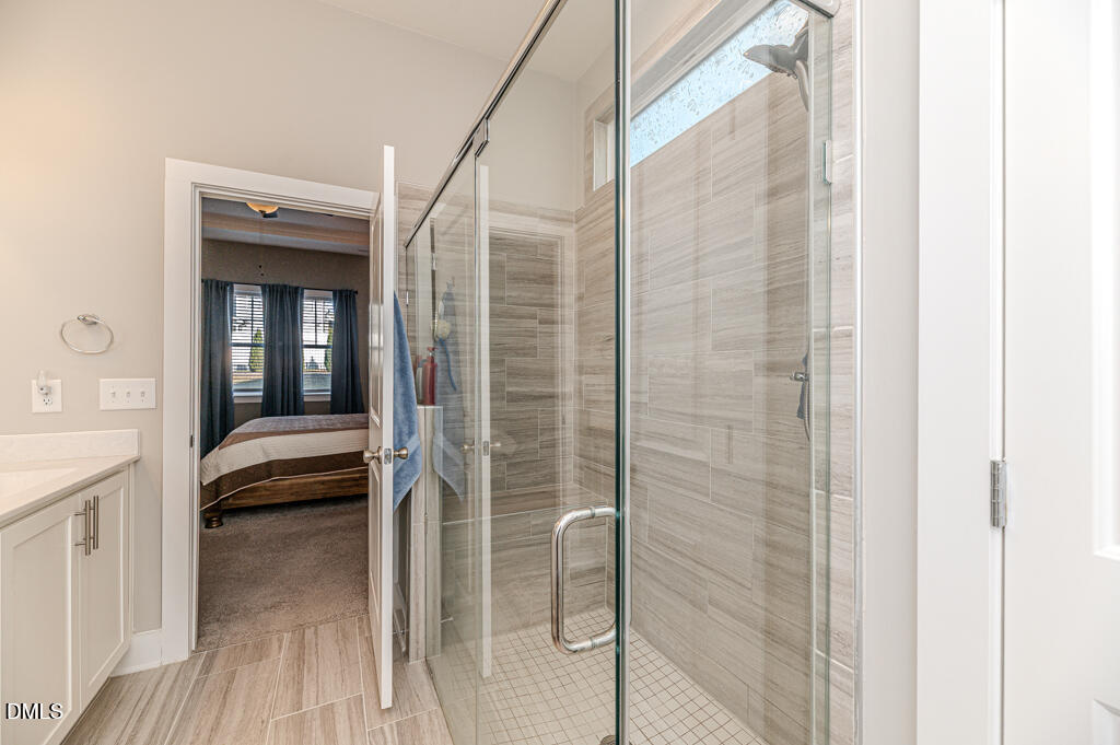 22 Camille Brooks Drive Angier, NC 27501 - Photo 11 of 52 a bathroom with a tub and shower