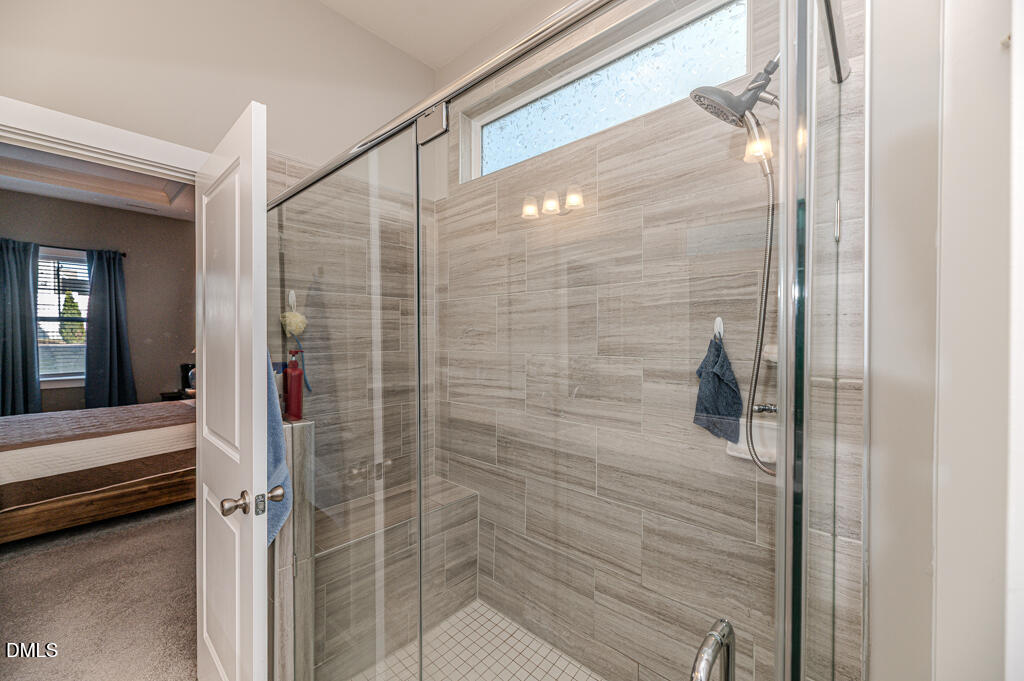 22 Camille Brooks Drive Angier, NC 27501 - Photo 13 of 52 a bathroom with a shower