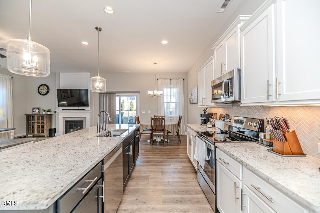 22 Camille Brooks Drive Angier, NC 27501 - Photo 27 of 52 a kitchen with granite countertop lots of counter top space