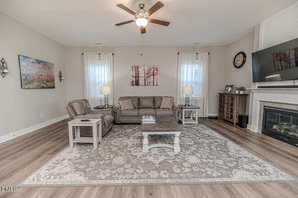 22 Camille Brooks Drive Angier, NC 27501 - Photo 28 of 52 a living room with furniture and a fireplace