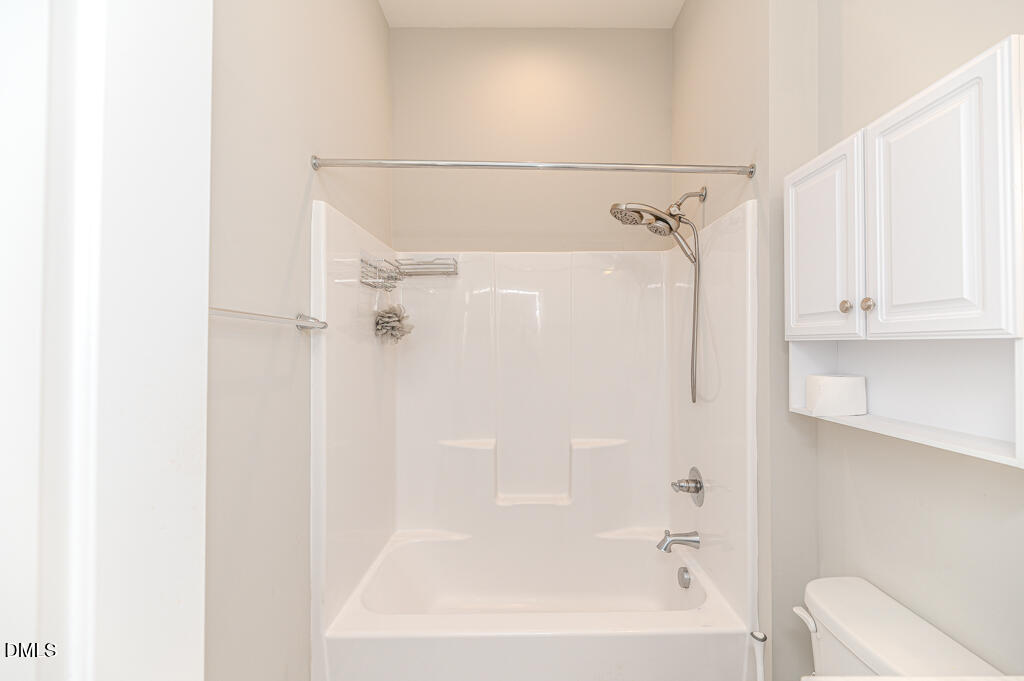 22 Camille Brooks Drive Angier, NC 27501 - Photo 38 of 52 a bathroom with a bathtub and a shower