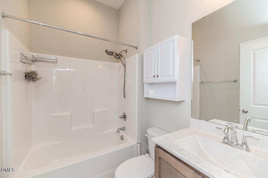 22 Camille Brooks Drive Angier, NC 27501 - Photo 39 of 52 a bathroom with a granite countertop sink toilet and shower