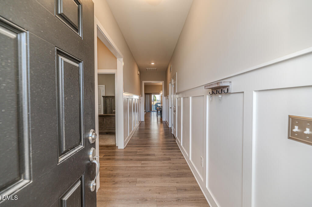 22 Camille Brooks Drive Angier, NC 27501 - Photo 43 of 52 a view of a hallway with wooden floor and stairs