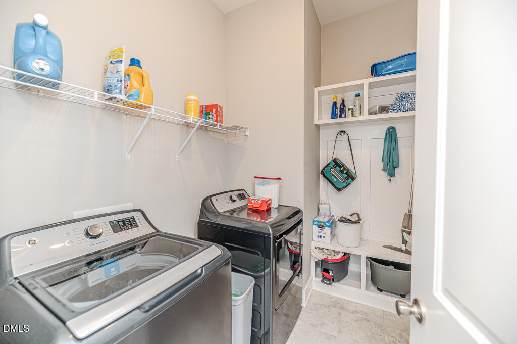 22 Camille Brooks Drive Angier, NC 27501 - Photo 44 of 52 a utility room with dryer and washer