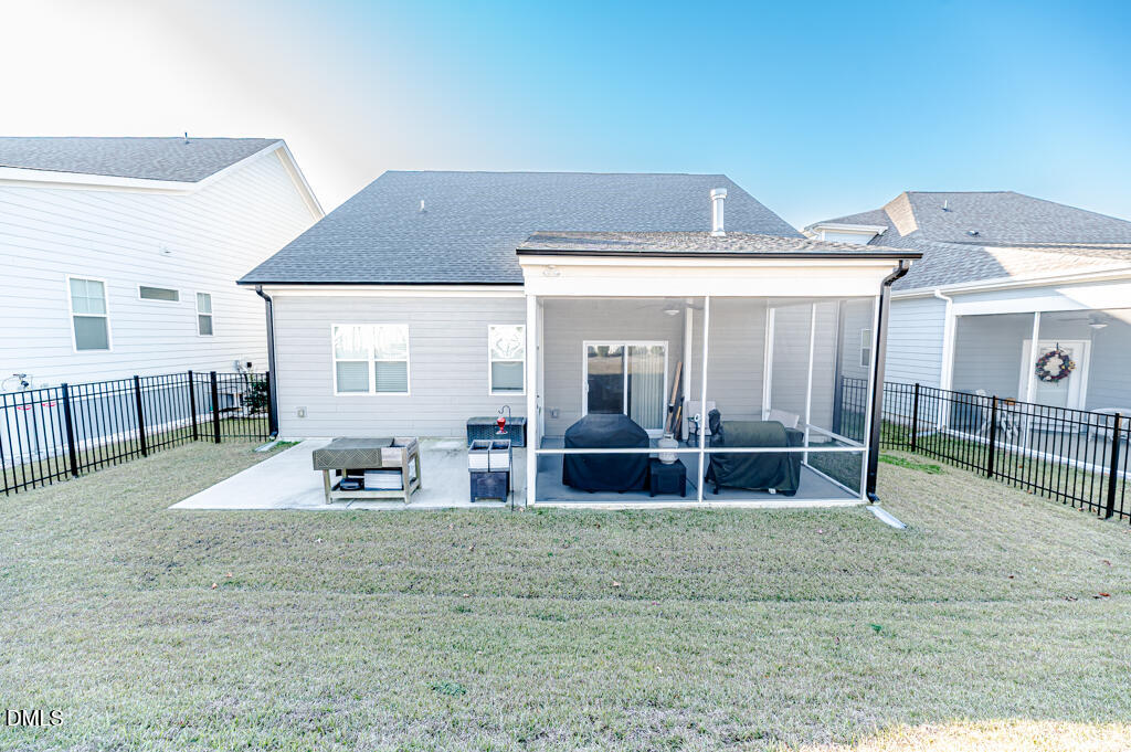 22 Camille Brooks Drive Angier, NC 27501 - Photo 48 of 52 a front view of a house with garden