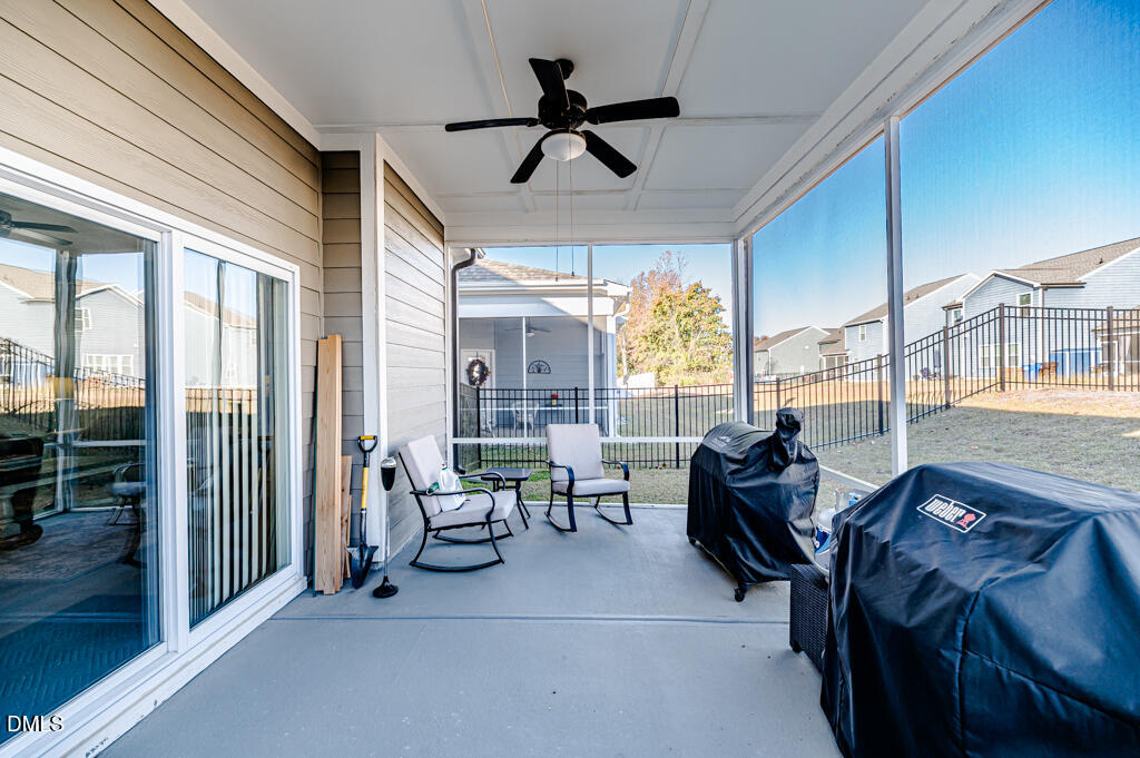 22 Camille Brooks Drive Angier, NC 27501 - Photo 52 of 52 a living room with furniture and a large window