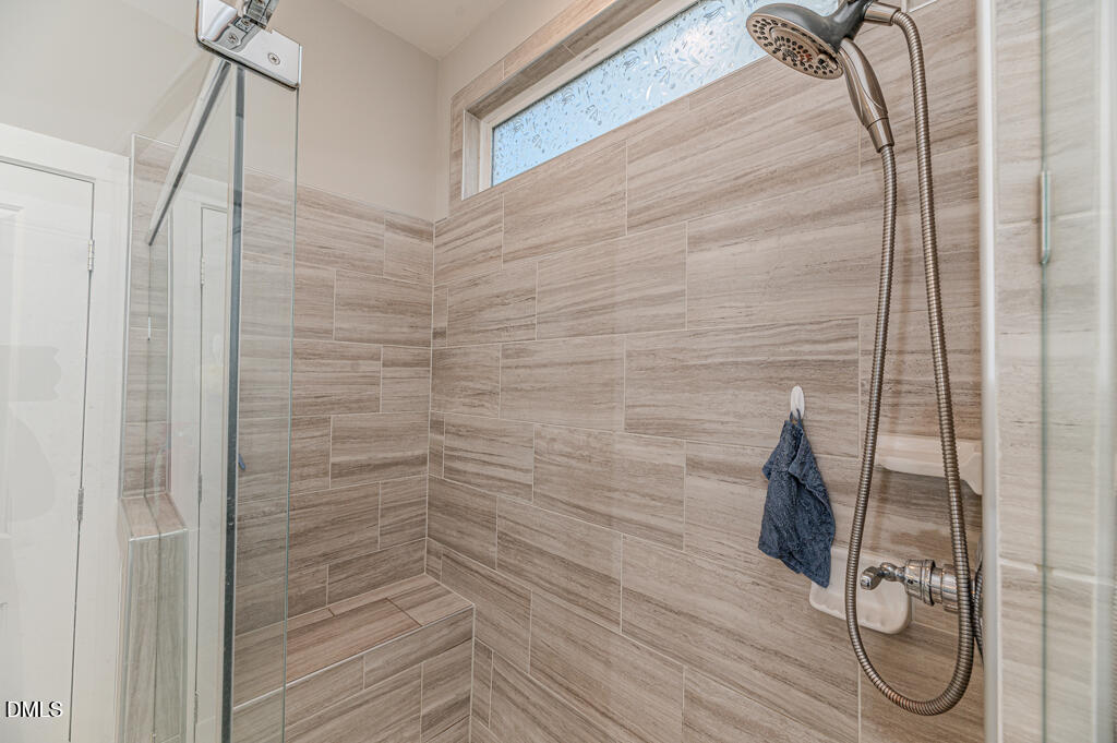 22 Camille Brooks Drive Angier, NC 27501 - Photo 7 of 52 a bathroom with a shower