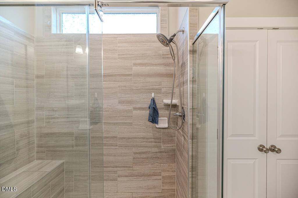 22 Camille Brooks Drive Angier, NC 27501 - Photo 8 of 52 a bathroom with a shower