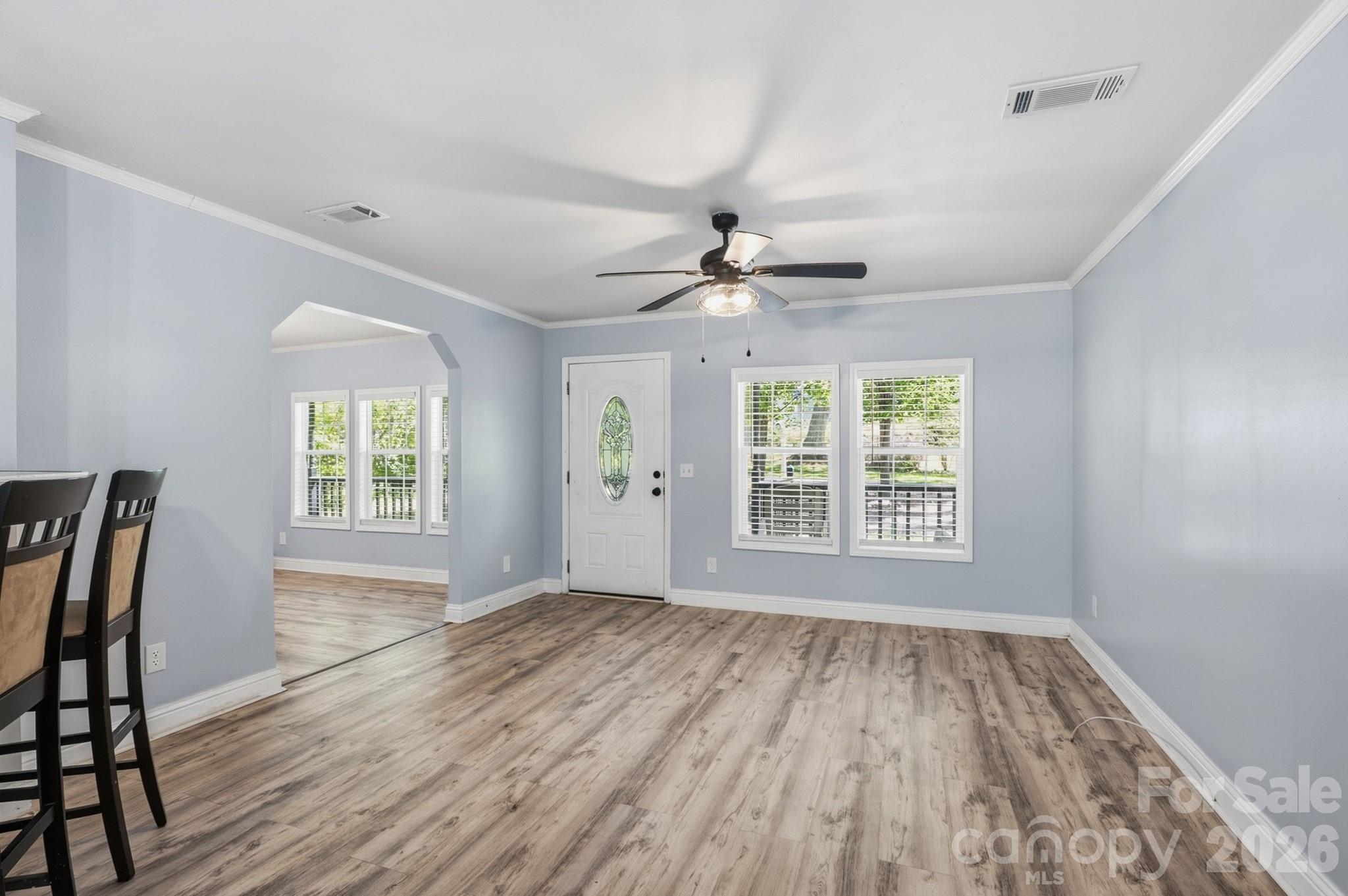 116 Springdale Drive York, SC 29745 - Photo 14 of 32 a view of an empty room with a window and wooden floor