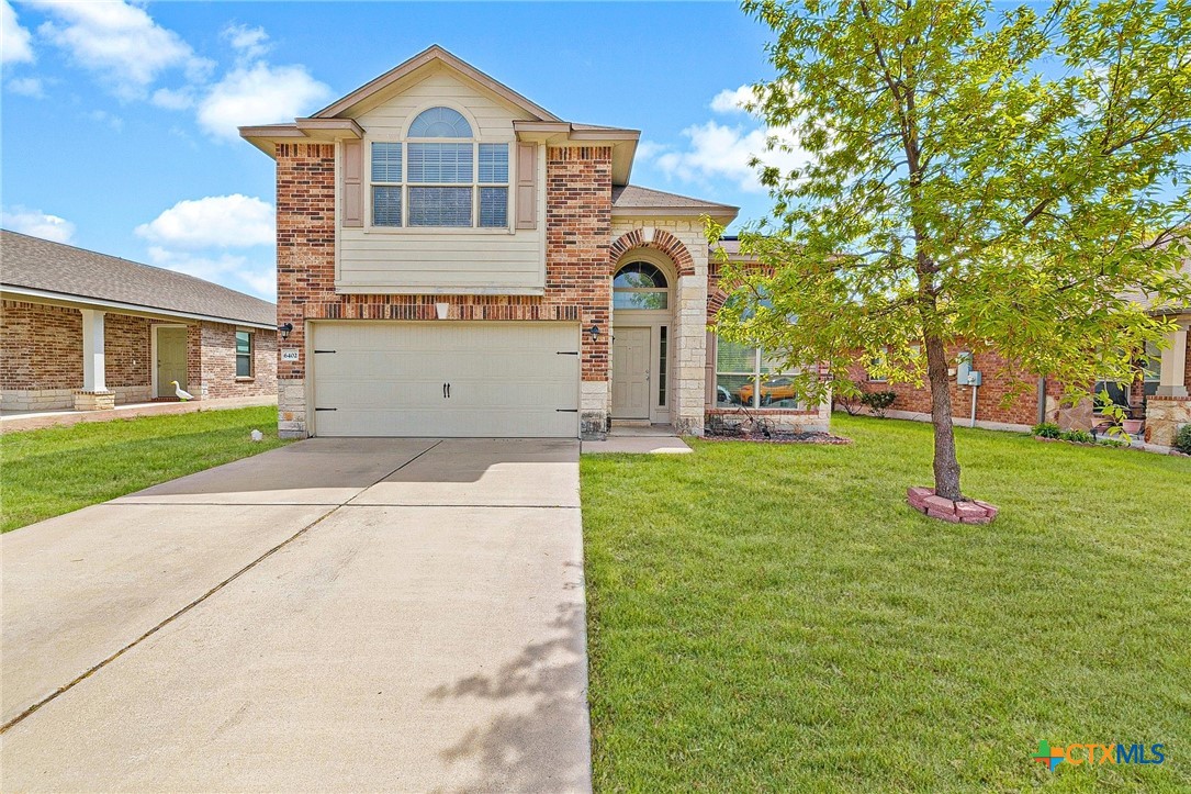 6402 Clear Brook Drive Killeen, TX 76549 - Photo 1 of 1 a front view of a house with a yard and trees