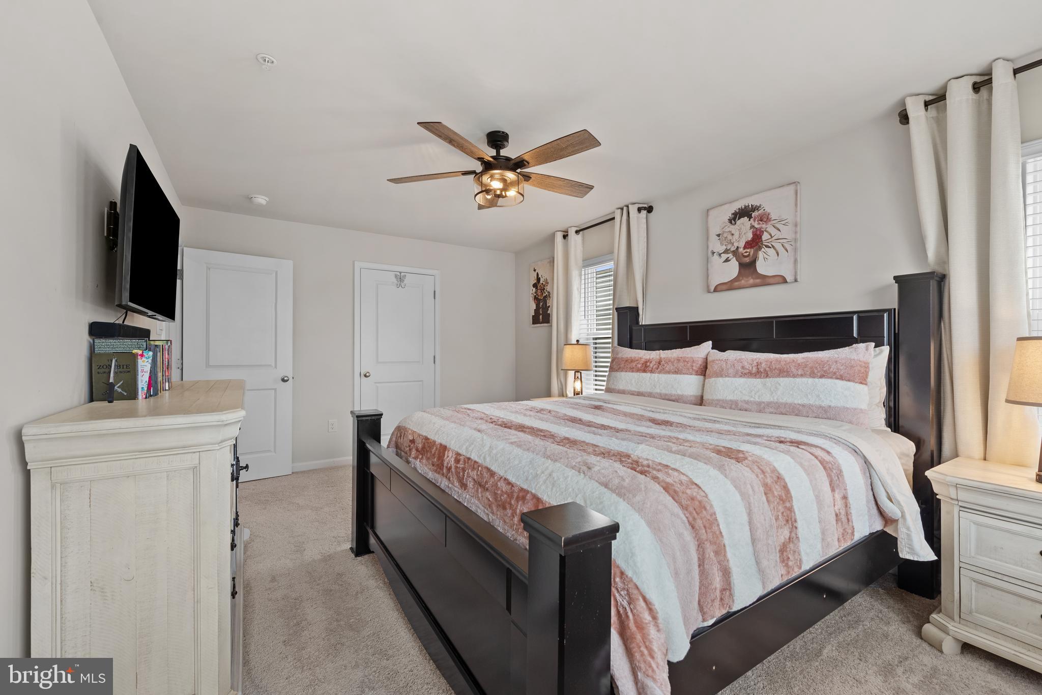 477 Tiller Street Frederick, MD 21701 - Photo 12 of 35 a bedroom with a bed and a flat screen tv