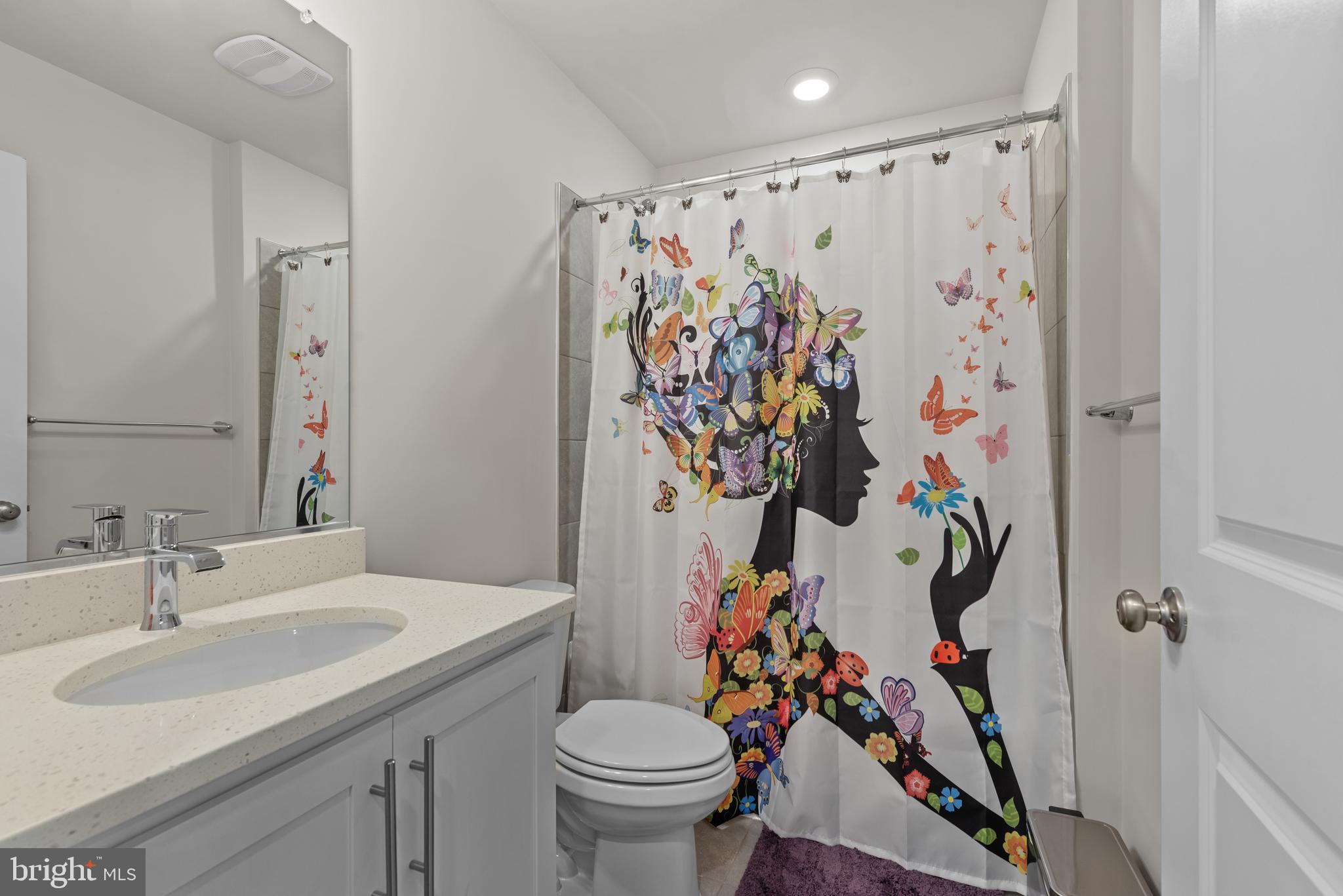 477 Tiller Street Frederick, MD 21701 - Photo 21 of 35 a bathroom with a sink toilet and a mirror