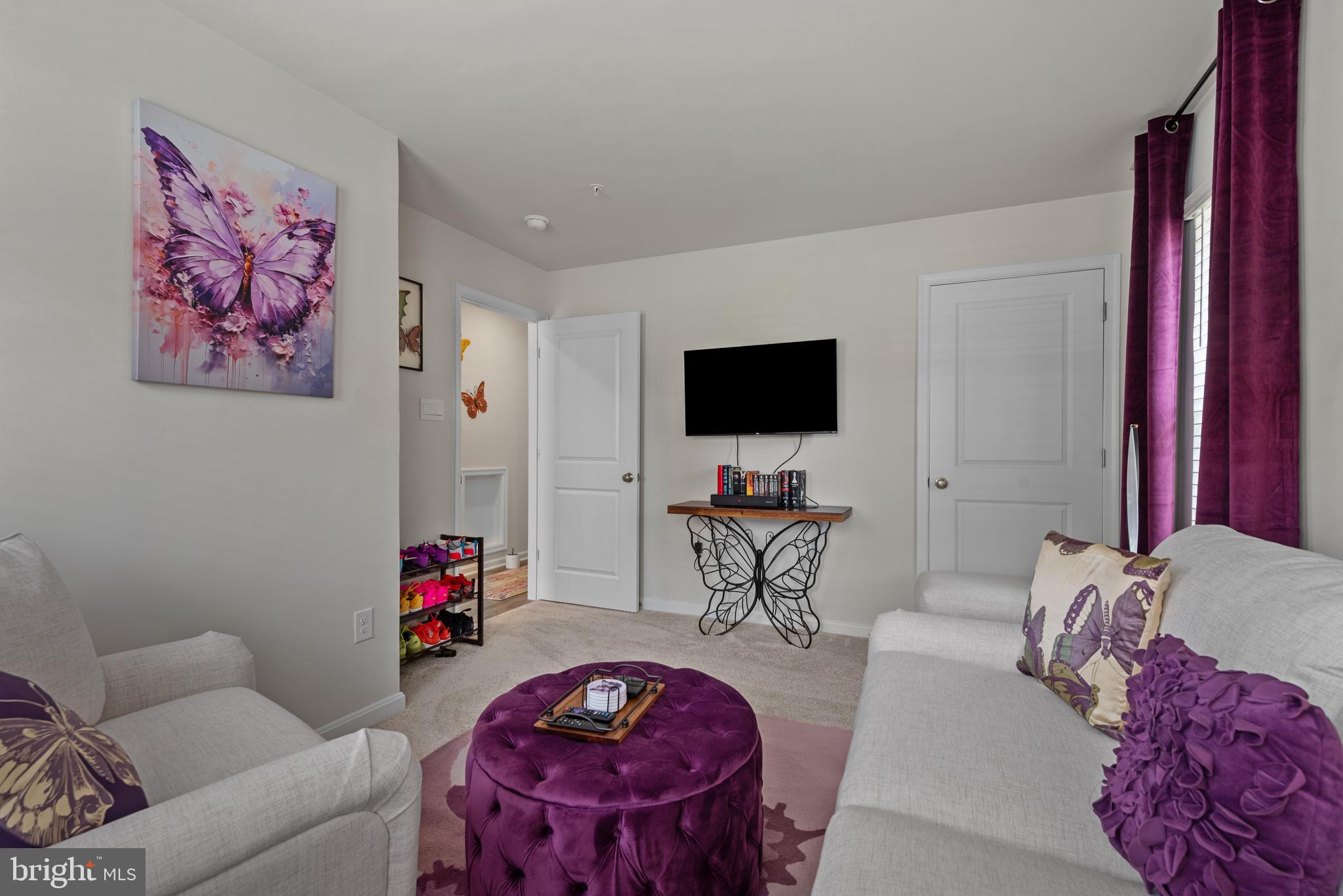 477 Tiller Street Frederick, MD 21701 - Photo 24 of 35 a living room with furniture and a flat screen tv