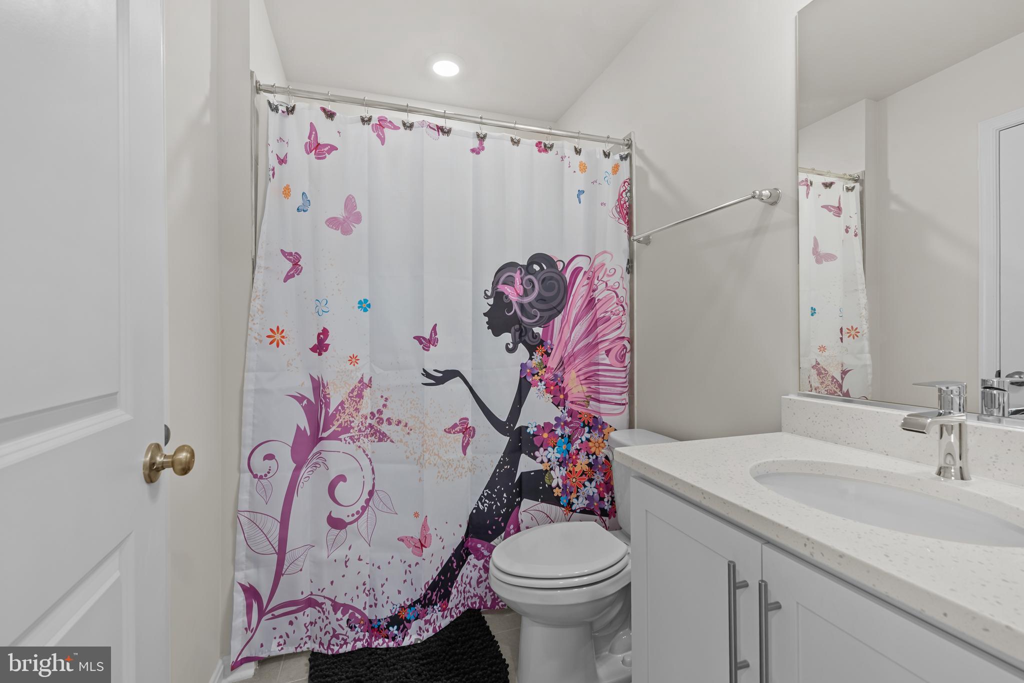 477 Tiller Street Frederick, MD 21701 - Photo 25 of 35 a bathroom with a sink toilet and shower curtain