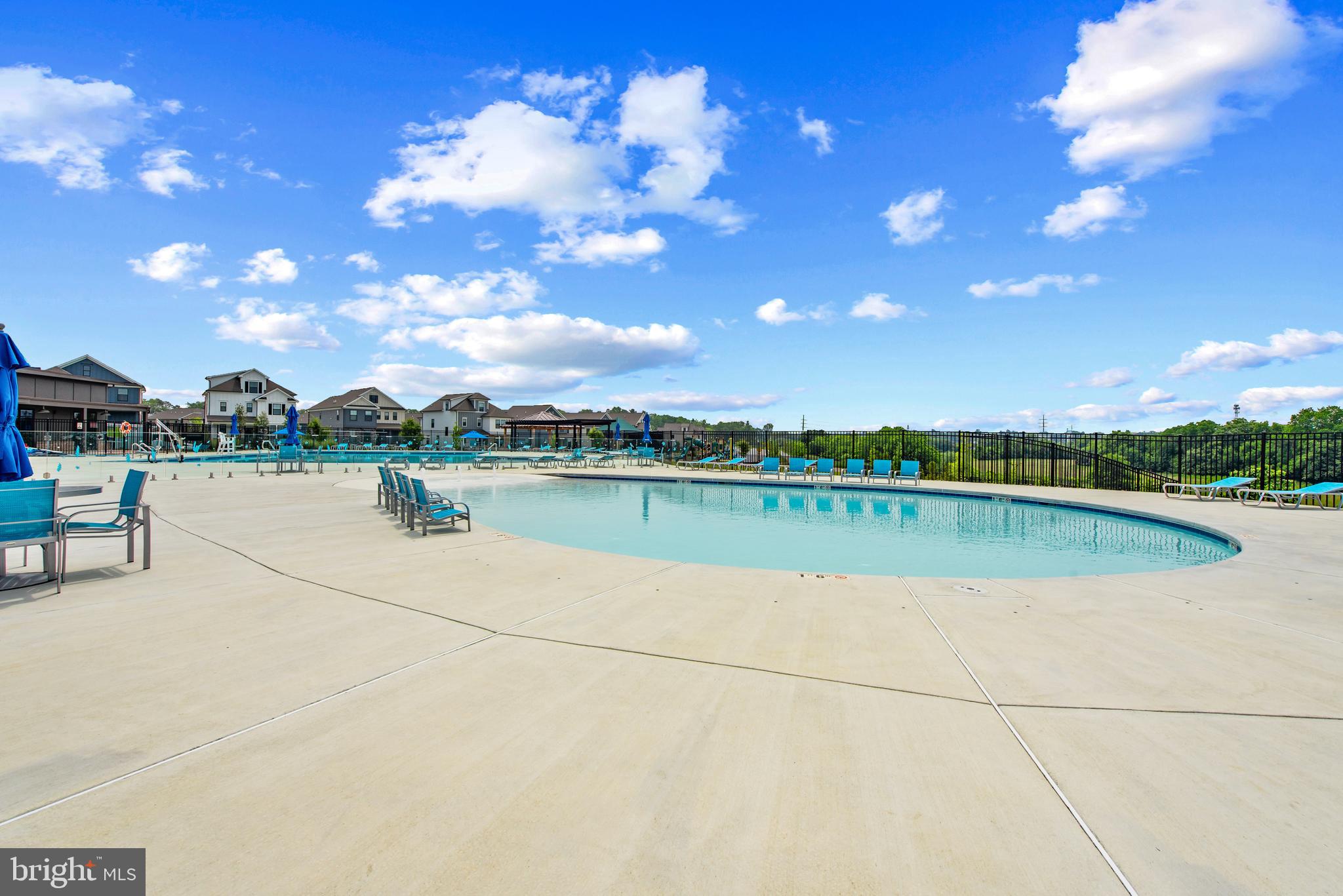 477 Tiller Street Frederick, MD 21701 - Photo 33 of 35 a view of swimming pool with seating space and yard in back