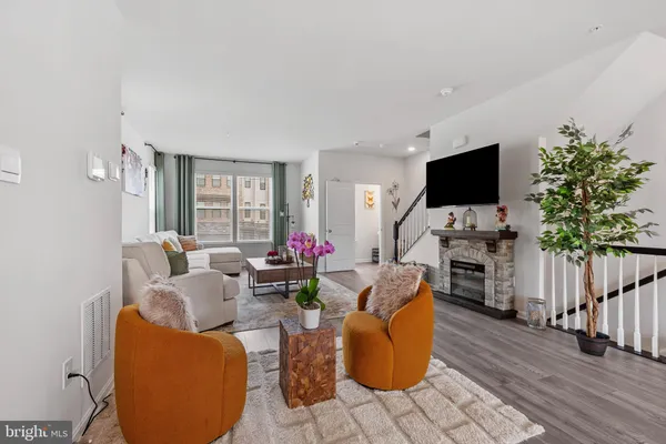 a living room with furniture and flat screen tv