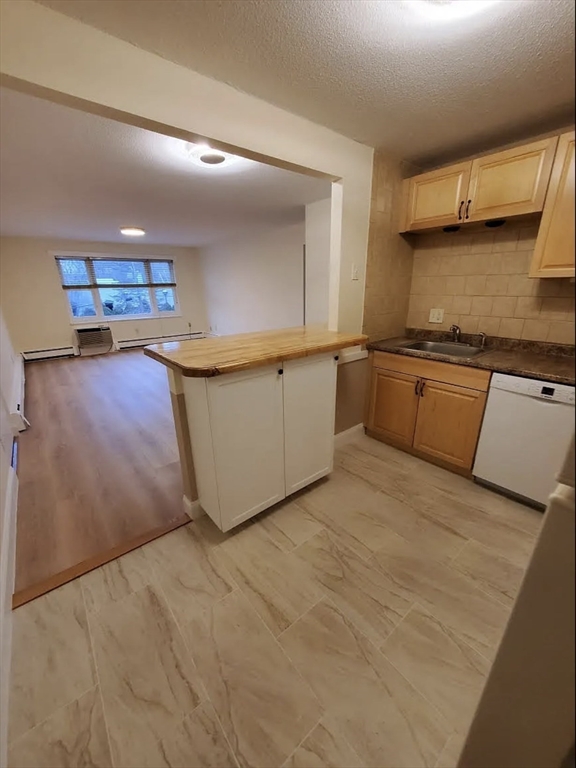 A2 Colonial Drive, Unit 10 Andover, MA 01810 - Photo 1 of 20 a kitchen with stainless steel appliances granite countertop a sink stove and cabinets