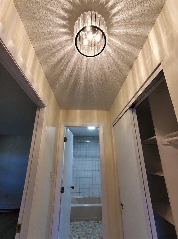 A2 Colonial Drive, Unit 10 Andover, MA 01810 - Photo 19 of 20 a bathroom with a mirror and a shower