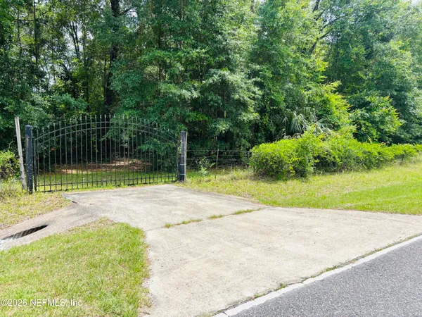a view of backyard with green space