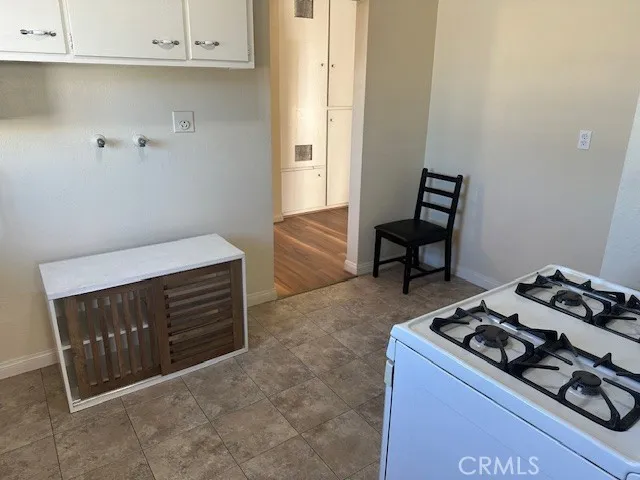 a kitchen with sink and cabinets