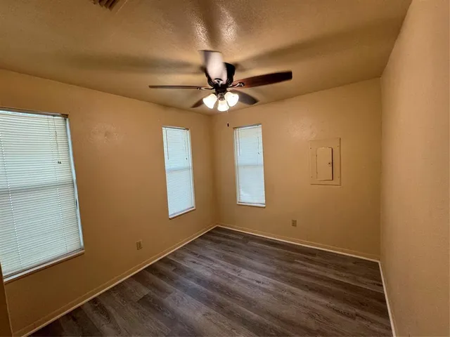 a view of room with window and ceiling fan