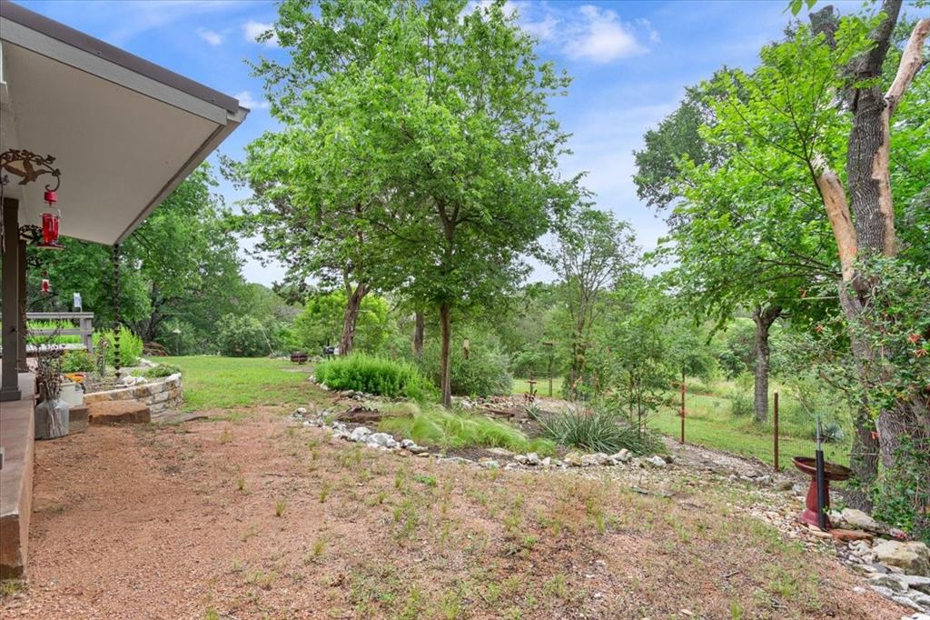 649 Wedgewood Drive China Spring, TX 76633 - Photo 31 of 39 View of grassy yard featuring view of scattered trees