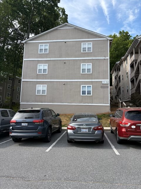 229 East King Street, Unit 31 Boone, NC 28607 - Photo 8 of 26 a car parked in front of a house