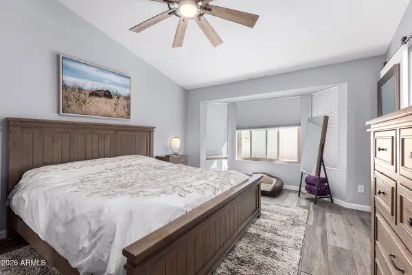 a bed room with a bed and a chandelier