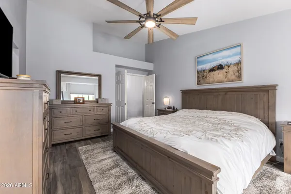 a bedroom with a bed and a dresser