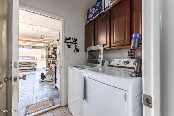 a view of kitchen appliances and cabinets