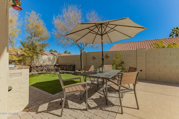a view of an outdoor sitting area with swimming pool