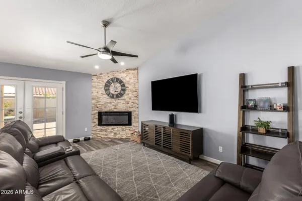 a living room with furniture and a flat screen tv