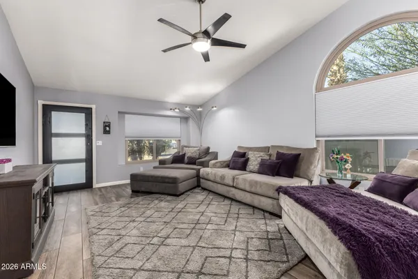 a living room with furniture and a large window