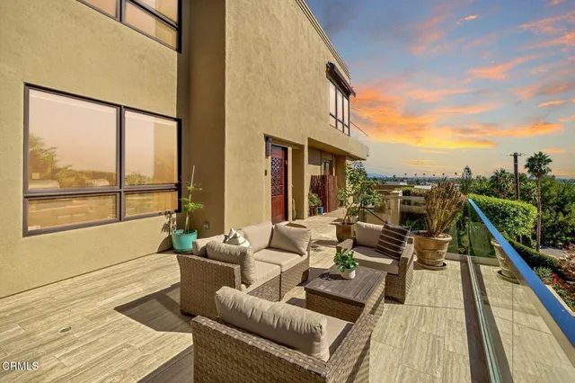 a vase of flowers sitting on a shelf