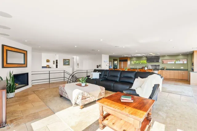 a view of a balcony with an outdoor seating