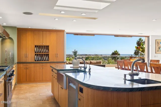 a large kitchen with kitchen island granite countertop a large counter top