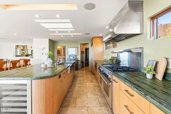a kitchen with a sink and a refrigerator