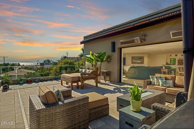 a living room with furniture and a bookshelf