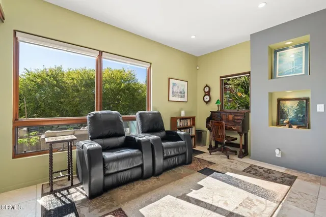 a bed room with a bed and a large window