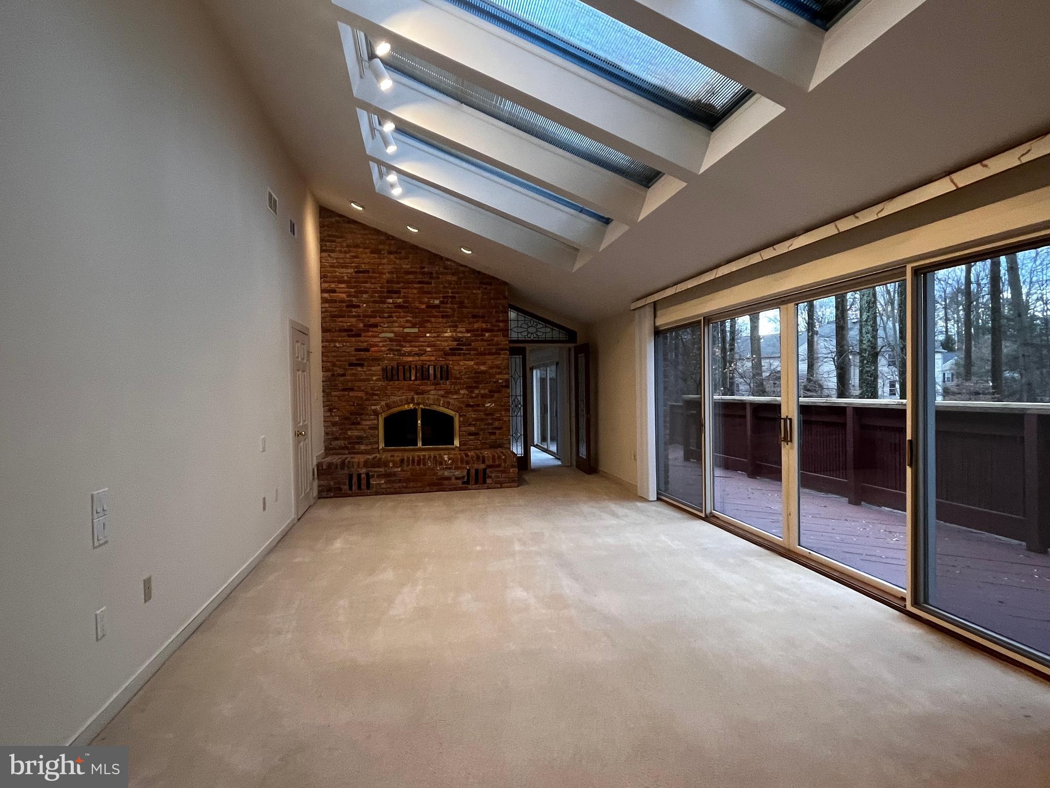 10 Redgate Court Silver Spring, MD 20905 - Photo 24 of 49 Main BR with fireplace, skylights, carpet