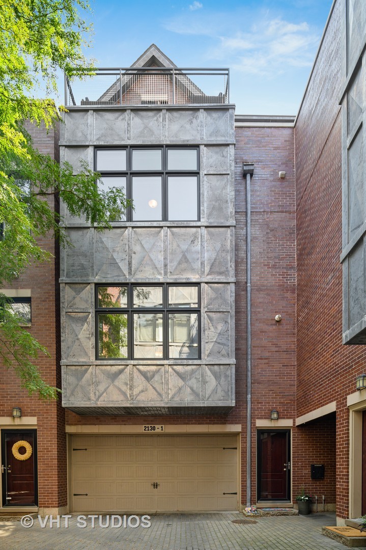 a view of a brick house with a large window