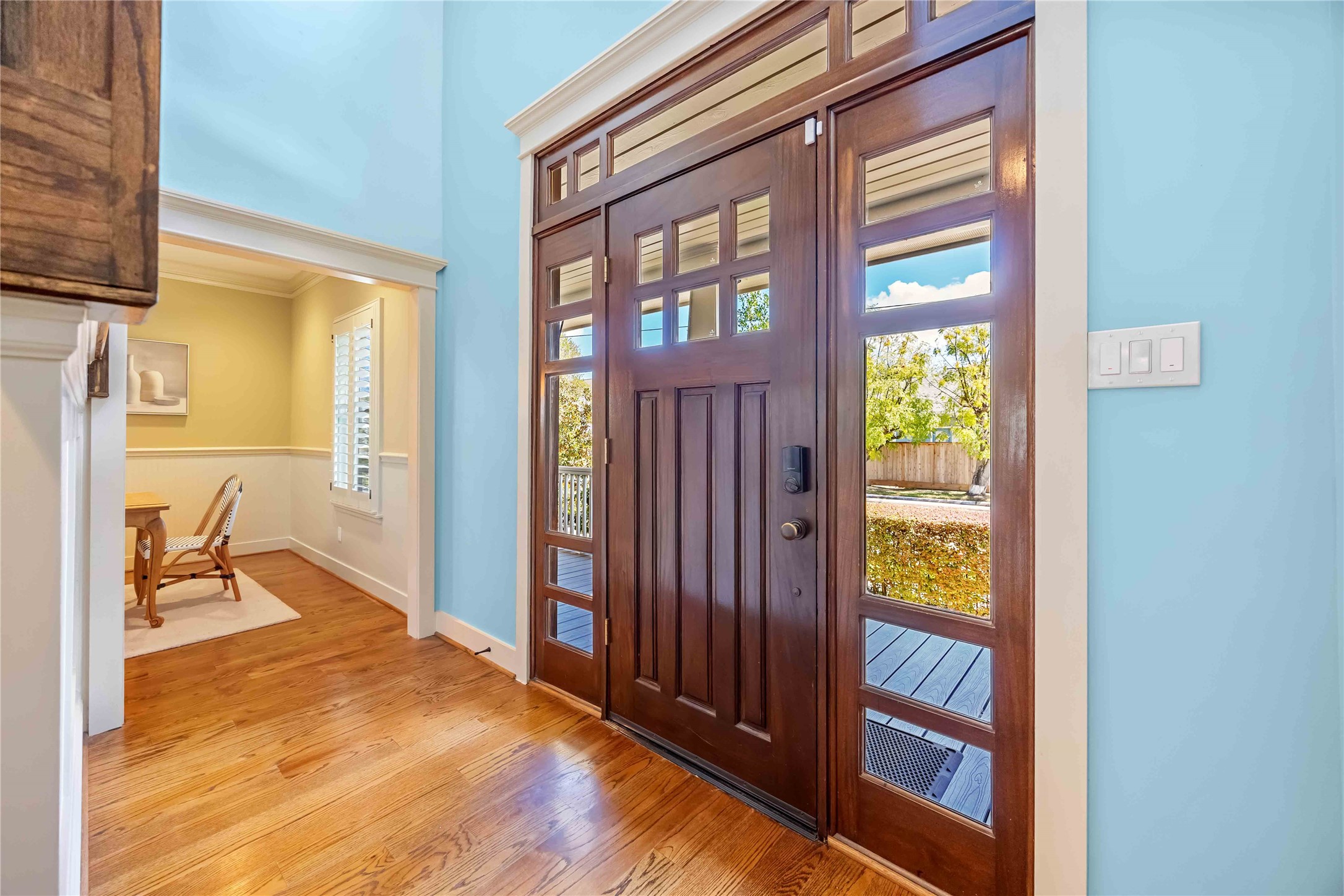 3541 Michaux Street Houston, TX 77009 - Photo 4 of 32 Tons of windows surround this beautiful wood door in the entry, providing a flood of beautiful light.