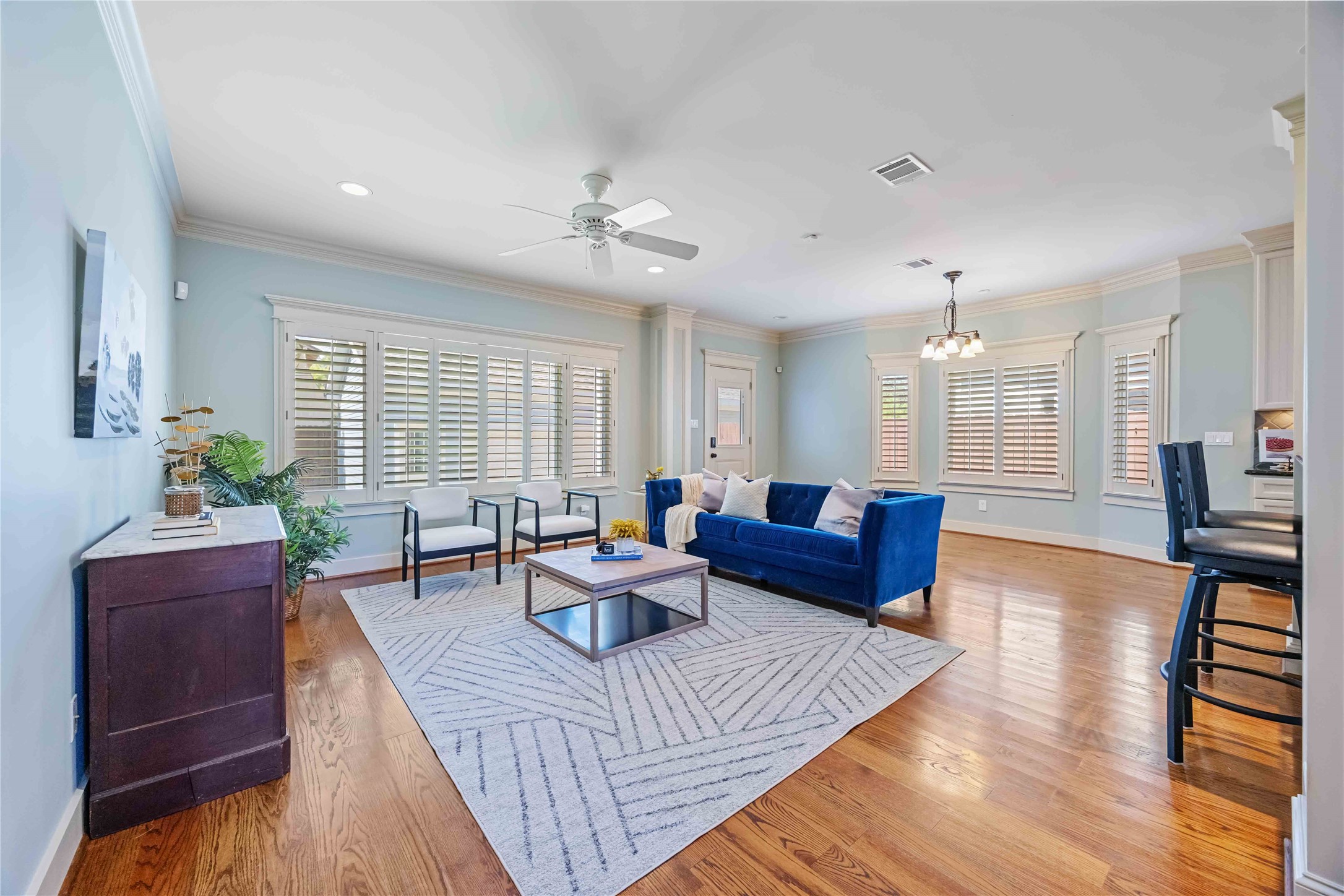 3541 Michaux Street Houston, TX 77009 - Photo 7 of 32 Open living area with beautiful wood floors and plantation shutters