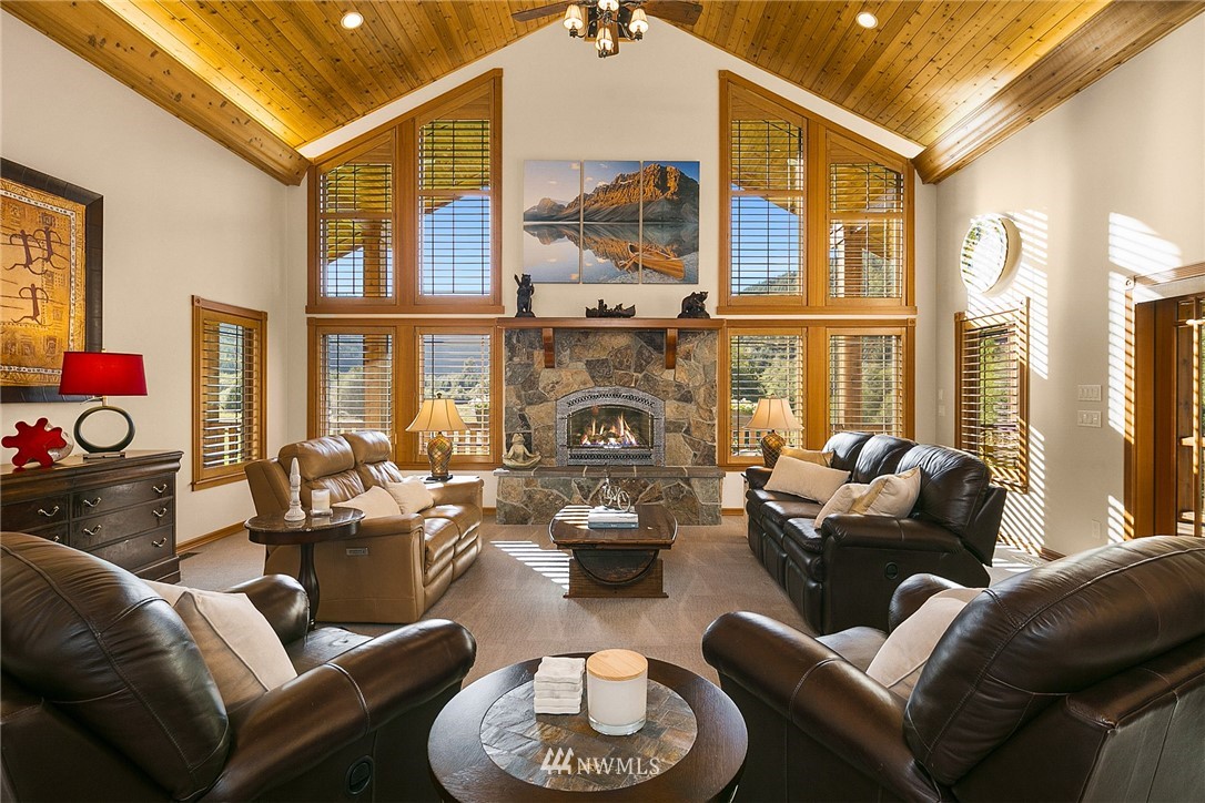 401 Highland Valley Road Morton, WA 98356 - Photo 11 of 39 a living room with furniture fireplace and a large window